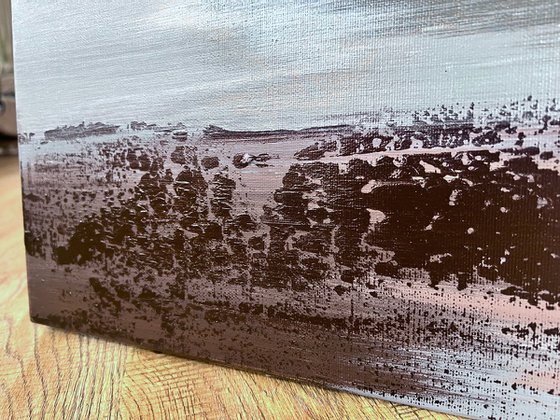 Textured gold and silver relief
