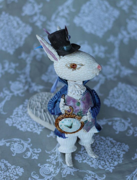I'm late! I'm late! For a very important date! White Rabbit, hanging sculpture.