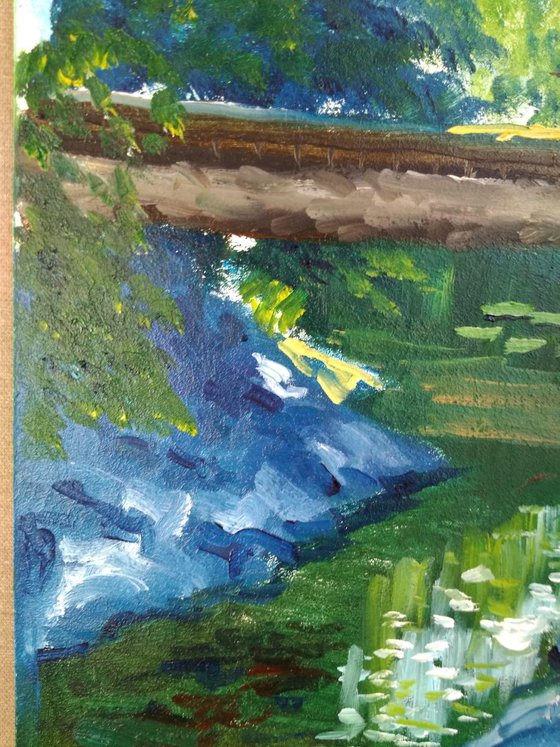 Creek with water lilies under the bridge. Pleinair painting