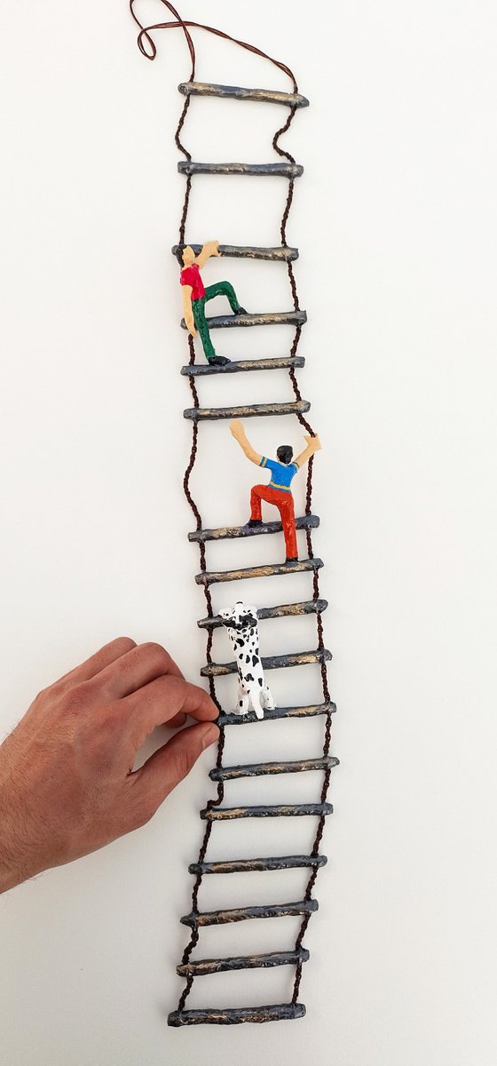Boys and the dog on ladder