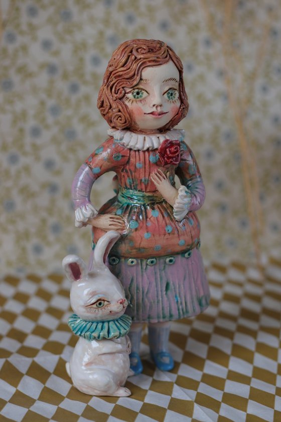 Vintage dressed girl with a rabbit