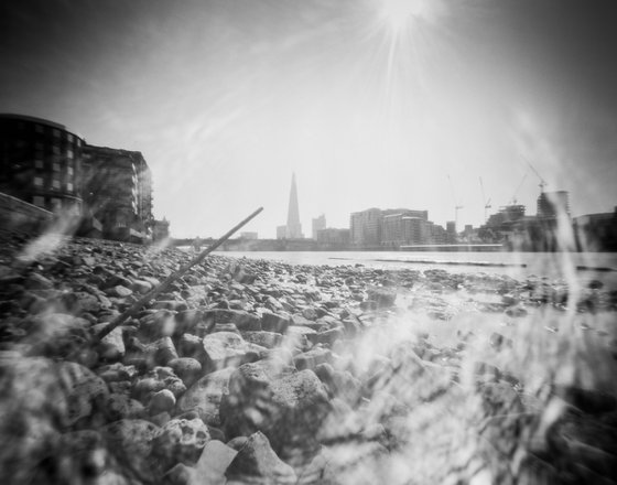 River Thames towards the Shard with pinhole sunflare, London