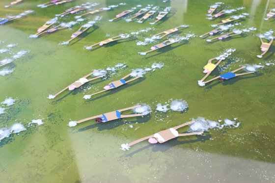 Swimmers 475 in Lake Carezza Italy epoxy resin green water