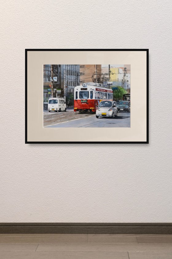Red and White Tram in the City