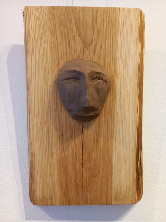 "Estimate" - clay wall sculpture