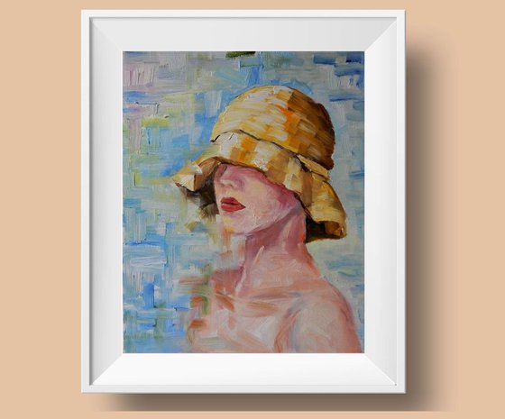 Portrait. Young lady in a yellow summer hat.