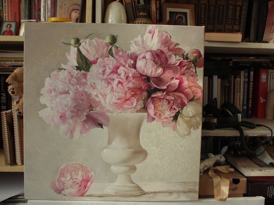 Bouquet of peonies in a white vase