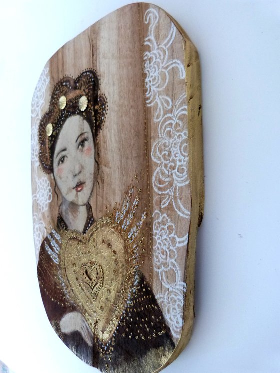 Portrait on wood, woman with a sacred heart. Sacred flight.