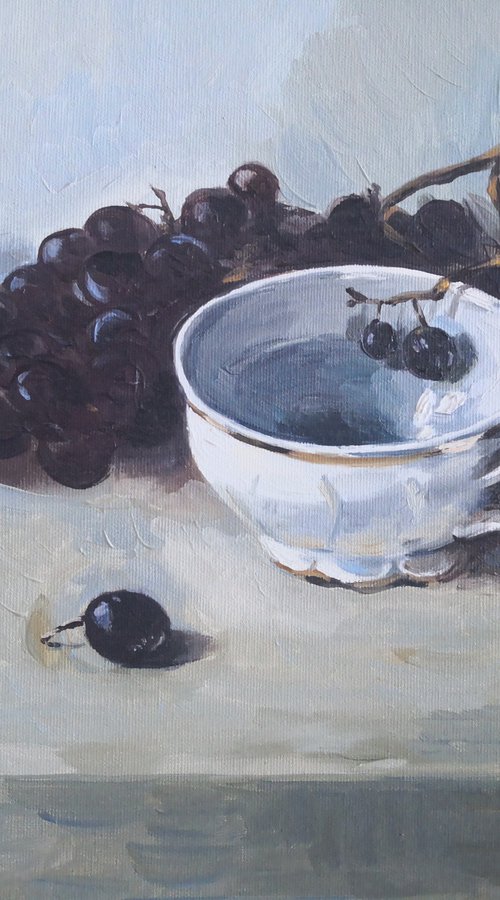 Black grapes and a porcelain cup still life by Jane Lantsman