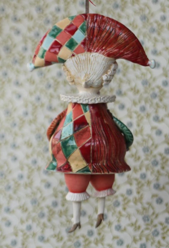 Harlequine. Sculptured bell-doll