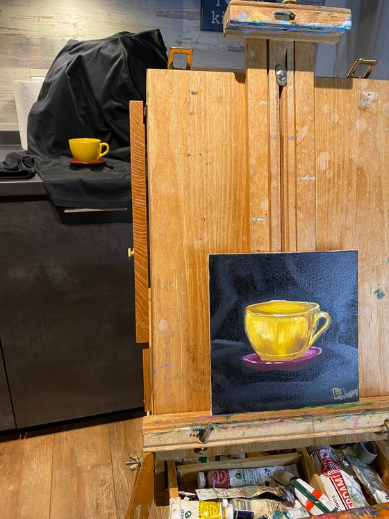 Yellow coffee cup still life