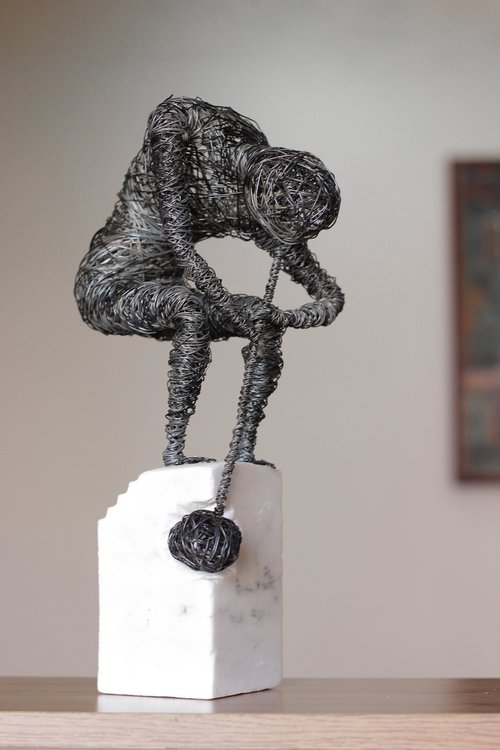 Self-violence (35x18x12 2.7kg iron, marble) by Karen Axikyan