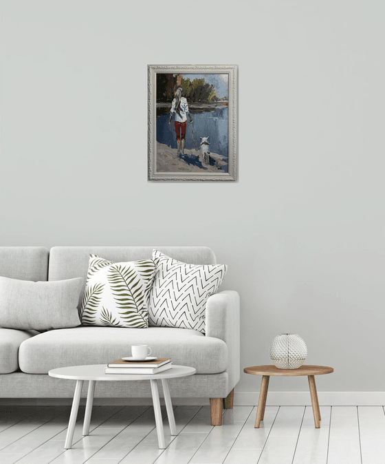 Woman walking with a dog.