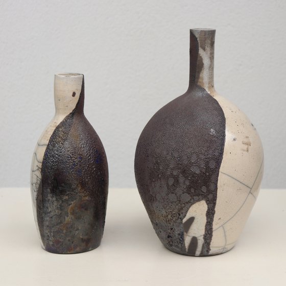 2 raku and black vessels