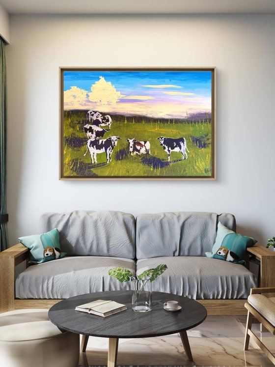 Cows grazing in the field