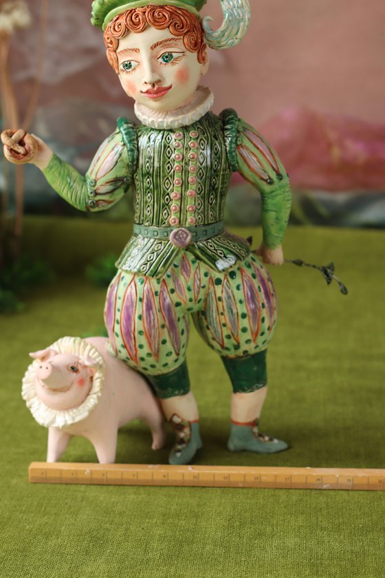Boy with a pig hiding his rod behind.