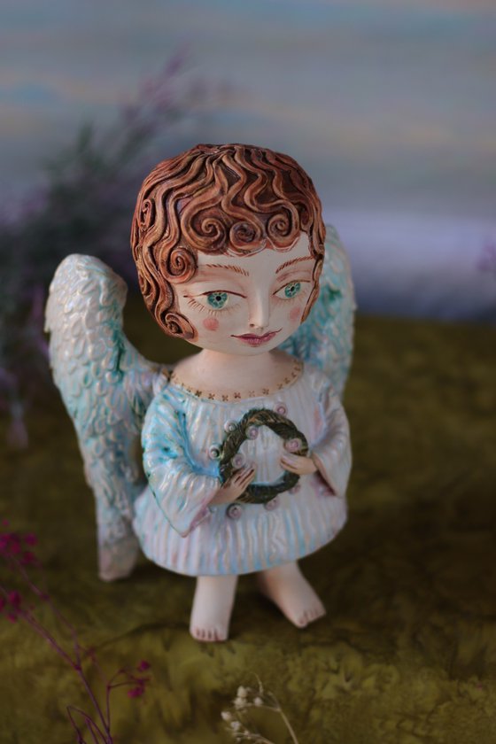 Angel with a flower.