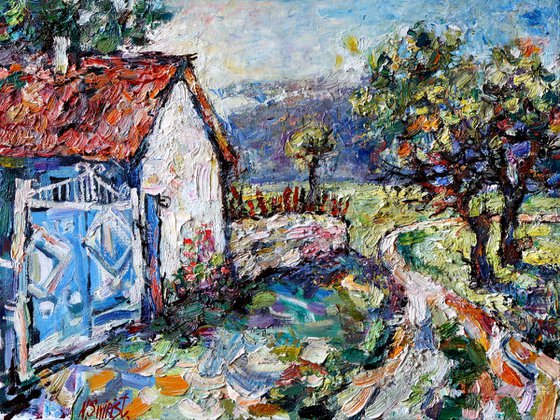Blue gate, road and trees.