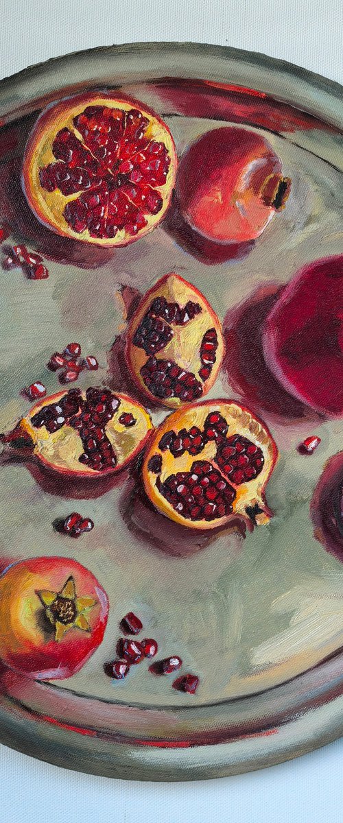 Pomegranates on metal try by Leyla Demir