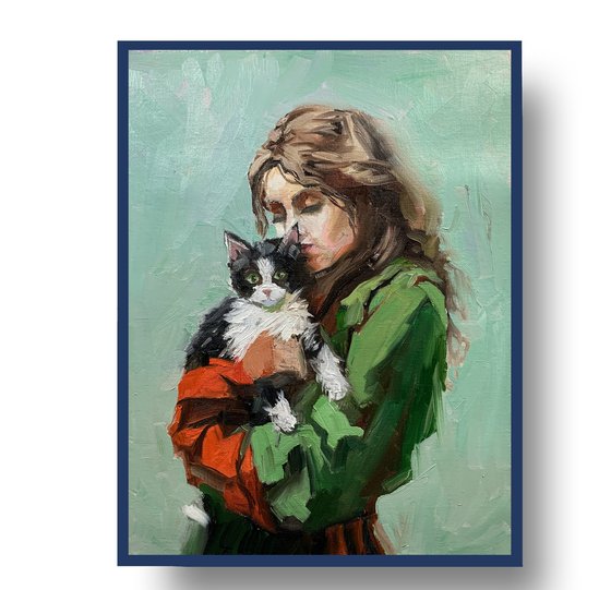 Girl in green dress with cat.