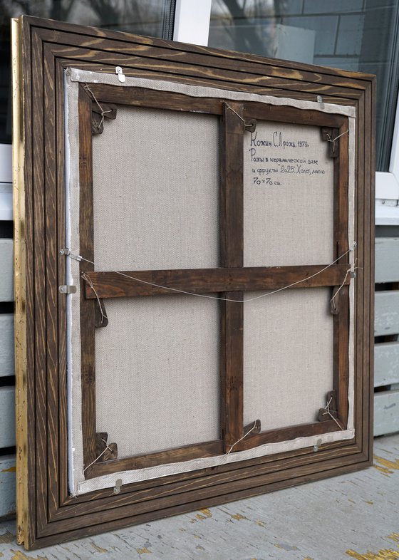 Roses in a ceramic vase and fruits