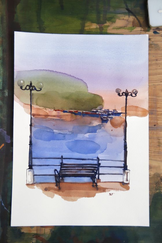 River flows, bench watches