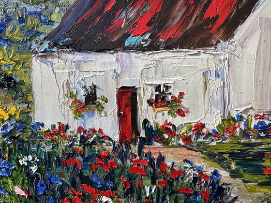Old house with red flowers