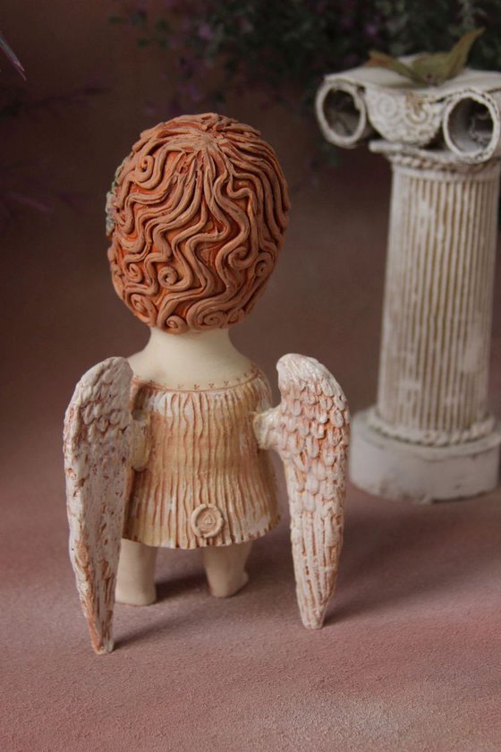 Angel holding a wreath. Ceramic OOAK sculpture.