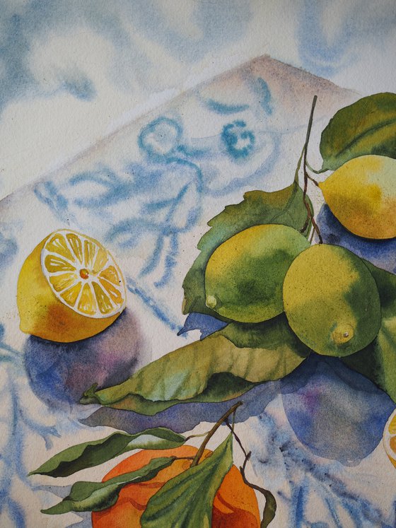 Lemons, orange and knife