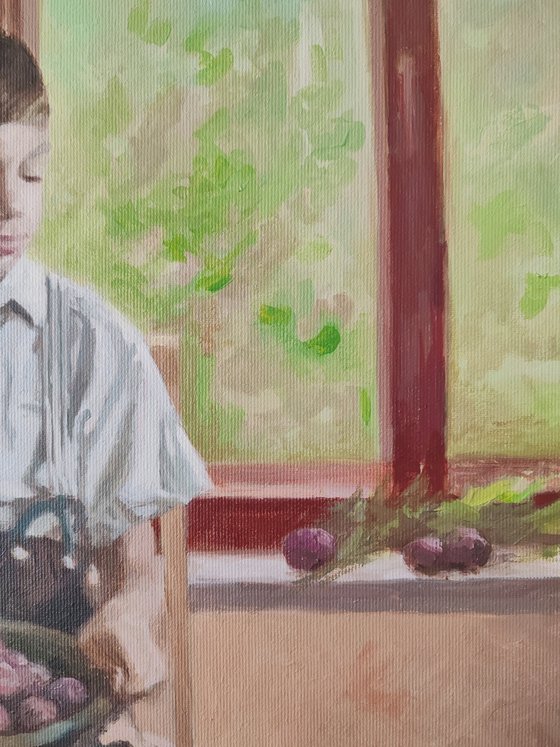 Boy with plums