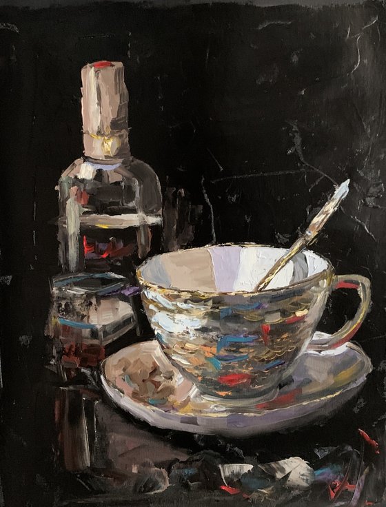 Tea cup and wine on black.