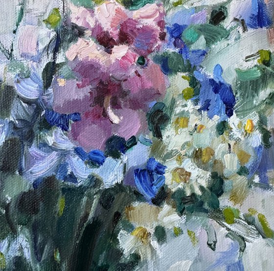 Blue wildflowers on window