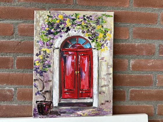 Red door with flowers