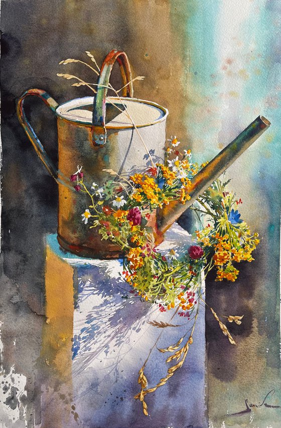 watering can with flowers