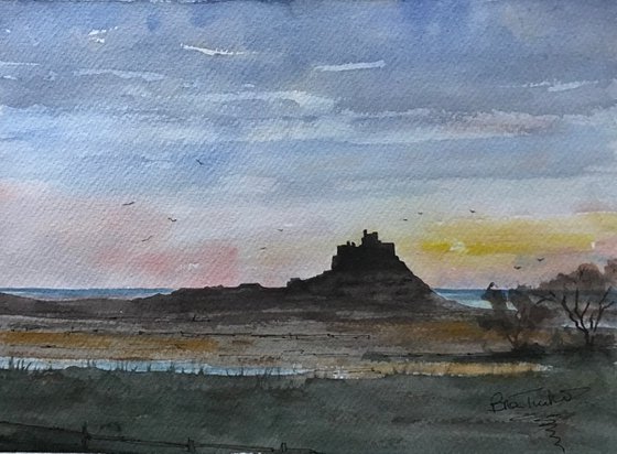Dawn sky at Lindisfarne castle