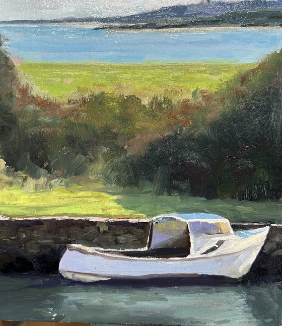 Safe harbour with white boat
