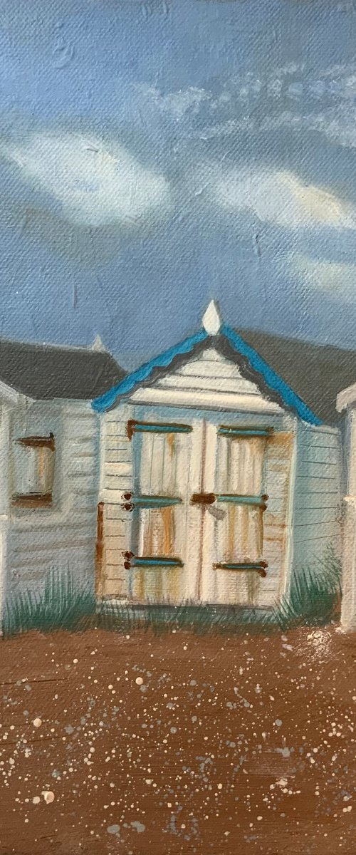 Beach huts by the shore by Mary Stubberfield