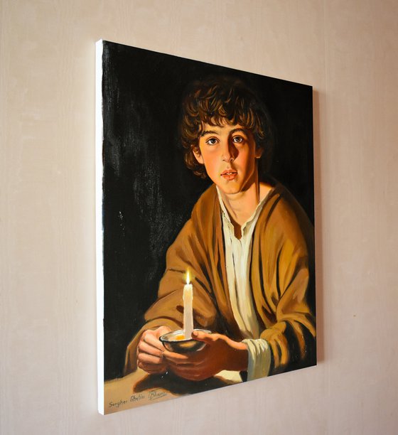 A boy with a candle