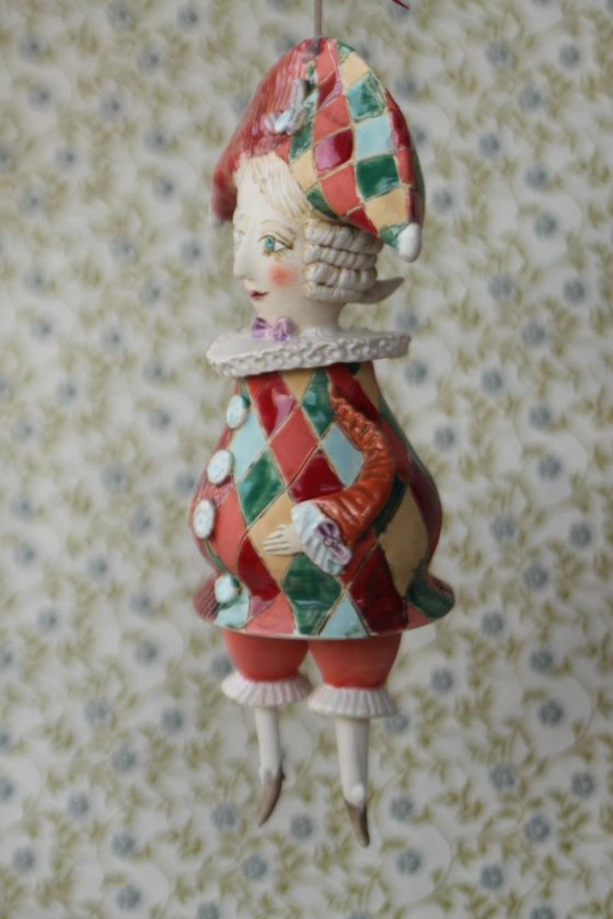 Harlequine. Sculptured bell-doll
