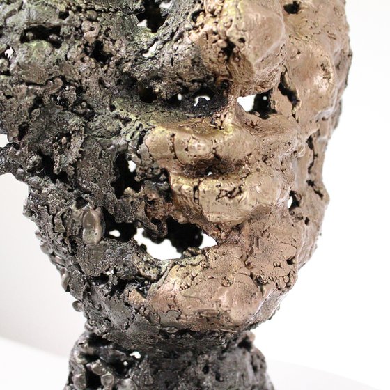 A rock - Face sculpture bronze steel