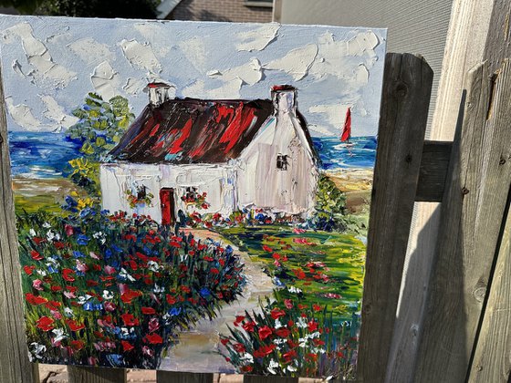 Old house with red flowers