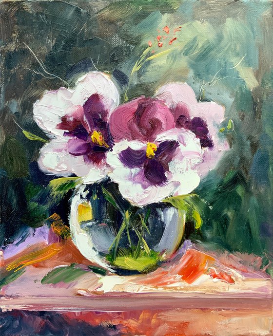 Pansies in a glass vase