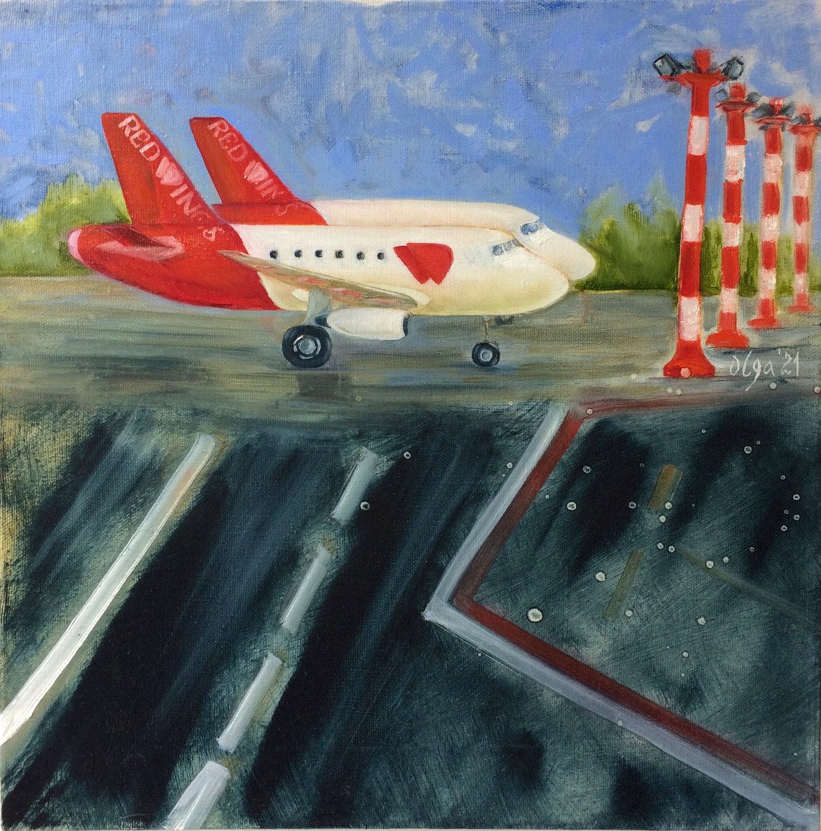 Two red and white airplanes on airfield by Olga Ivanova