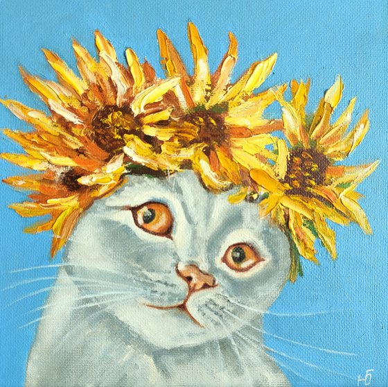 Cat and a wreath of sunflowers