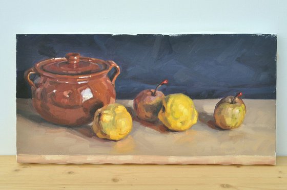 Quinces, passe crassane pears and an earthenware dish