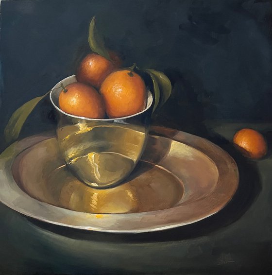 Kumquats in a gold bowl