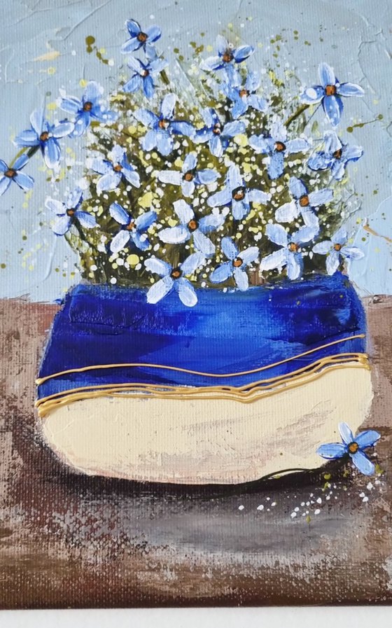 Vase with blue Flowers