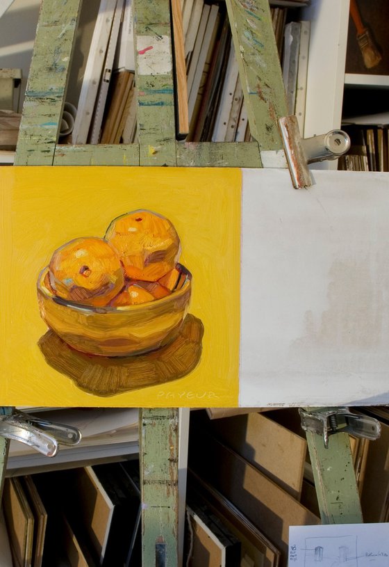 oranges on yellow background