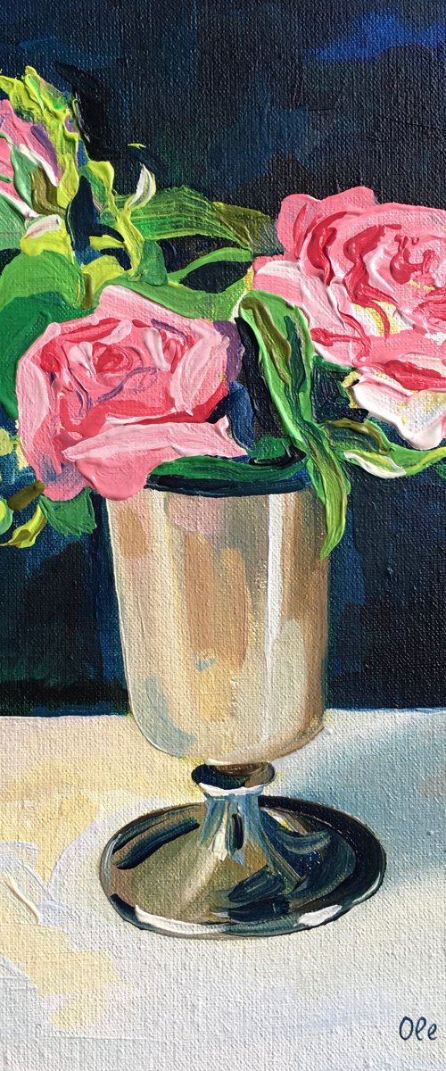 Miniature pink roses in a silver vase by Ole Karako