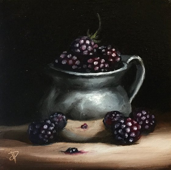 Silver cup with blackberries still life